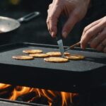 Person lighting a Blackstone 36'' griddle with a matchstick, step-by-step instructions in the background.